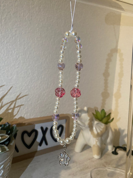 Rhinestone dog paw charm with red roses and hearts.